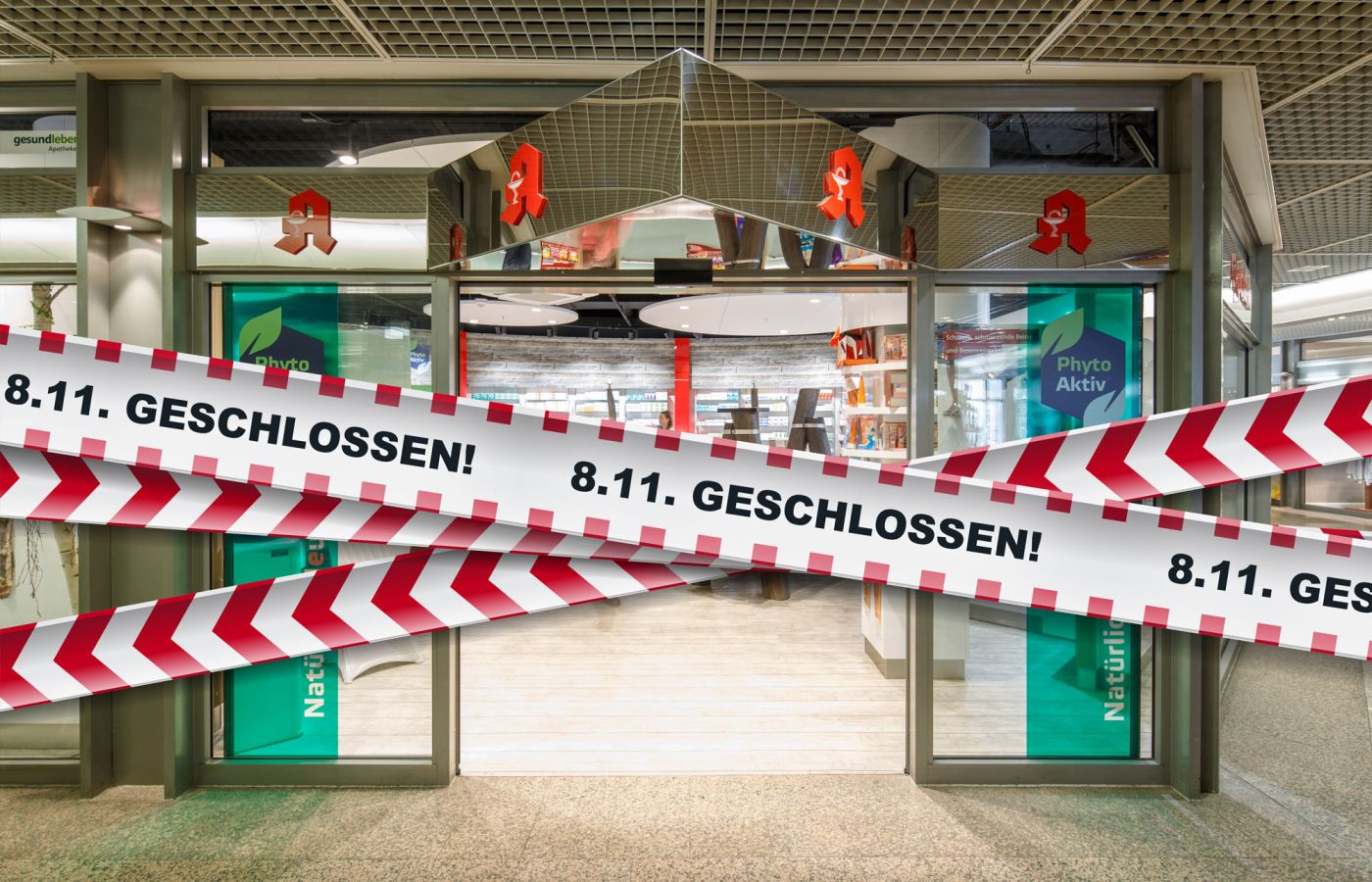 Eingang einer Apotheke mit Absperrband und Aufschrift 8.11. geschlossen